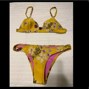 Triangl. Size small top and size medium bottom.